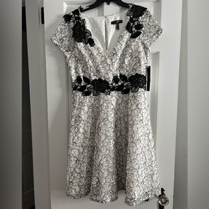Aidan Mattox black and ivory dress with beautiful lace detailing. Size 12 New